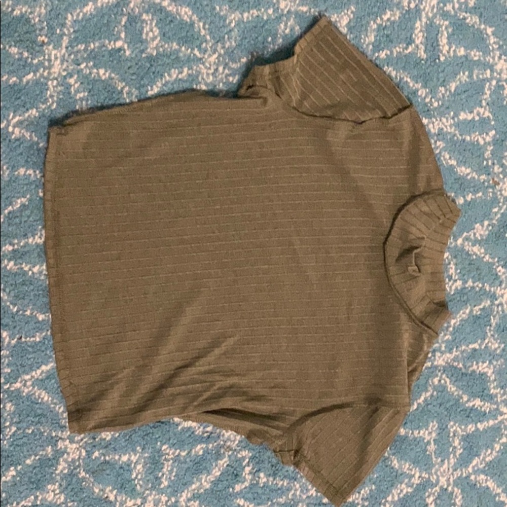 dark green crop top with a little turtle neck,